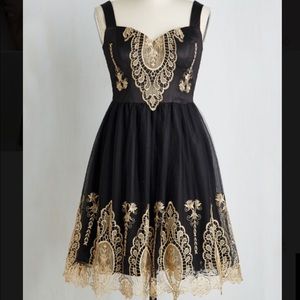 In the chandelier light dress